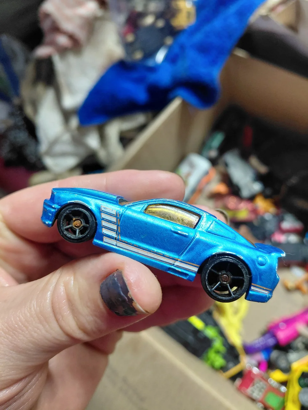 2009 Hot Wheels '07 Ford Mustang in metallic blue, originally part of the Mustan
